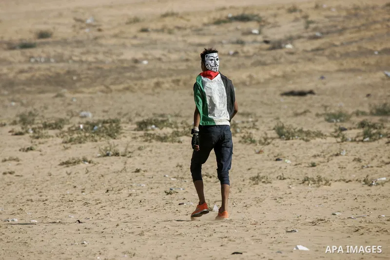 Palestinian protesters gather during clashes with Israeli troops in tents protest where Palestinian demand the right to return to their homeland at the Israel-Gaza border, in Rafah in the southern of Gaza Strip on June 2...