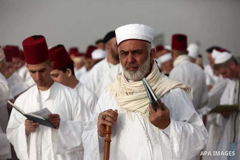 Samaritan worshipers pray on the top of Mount Gerizim in a traditional pilgrimage to mark the Shavuot's holiday at dawn near the West Bank city of Nablus June 24, 2018 which is giving of the Torah at Mount Sinai seven we...