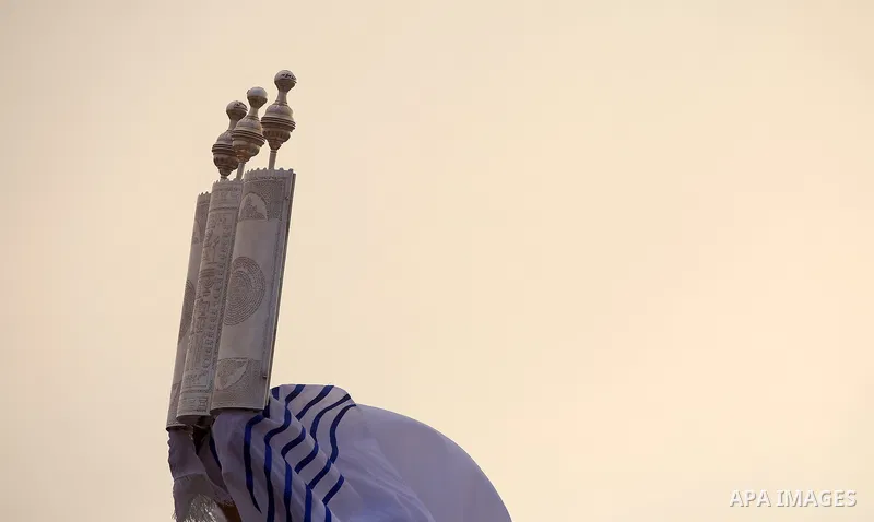 Samaritan worshipers pray on the top of Mount Gerizim in a traditional pilgrimage to mark the Shavuot's holiday at dawn near the West Bank city of Nablus June 24, 2018 which is giving of the Torah at Mount Sinai seven we...