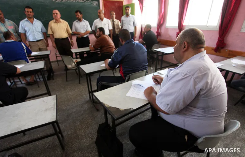 Palestinian students take their exam for a Mid School certificate at a school in Gaza City on June 24, 2018. Photo by Mahmoud Ajour