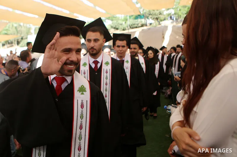 Palestinian students attend their graduation ceremony at the Birzeit University in the West Bank city of Ramallah, June 24, 2018. Photo by Shadi Hatem