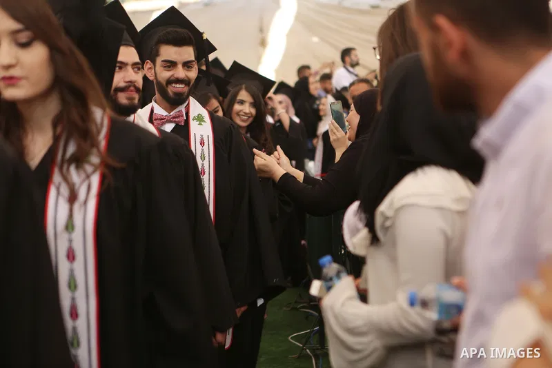 Palestinian students attend their graduation ceremony at the Birzeit University in the West Bank city of Ramallah, June 24, 2018. Photo by Shadi Hatem