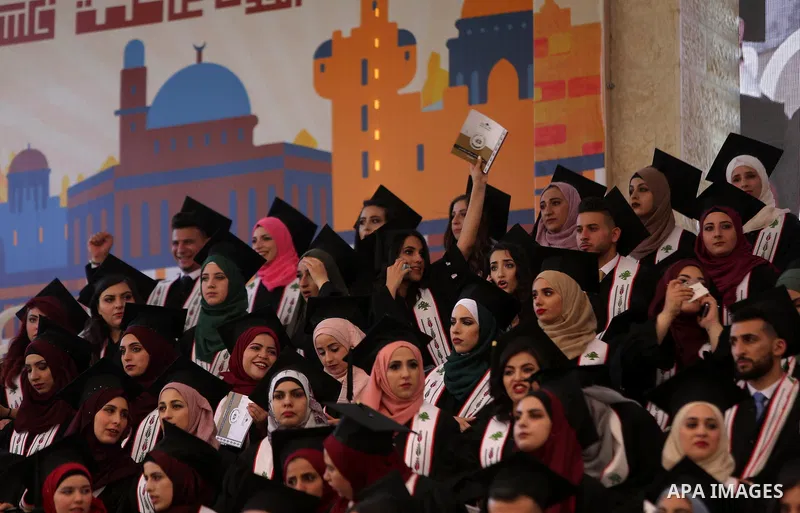 Palestinian students attend their graduation ceremony at the Birzeit University in the West Bank city of Ramallah, June 24, 2018. Photo by Shadi Hatem
