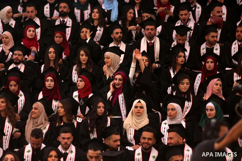 Palestinian students attend their graduation ceremony at the Birzeit University in the West Bank city of Ramallah, June 24, 2018. Photo by Shadi Hatem