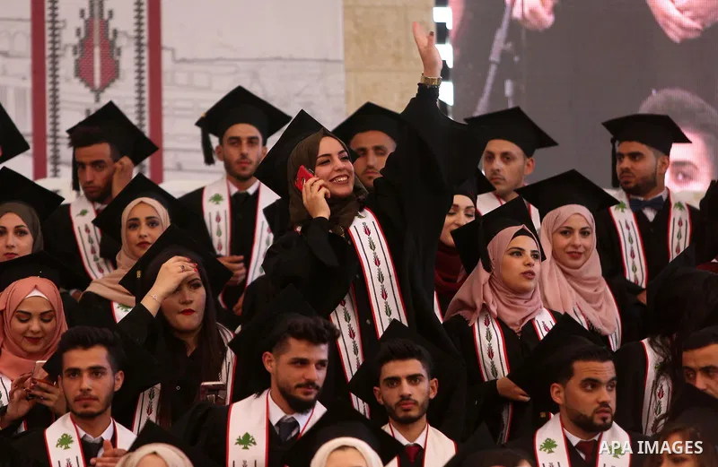Palestinian students attend their graduation ceremony at the Birzeit University in the West Bank city of Ramallah, June 24, 2018. Photo by Shadi Hatem