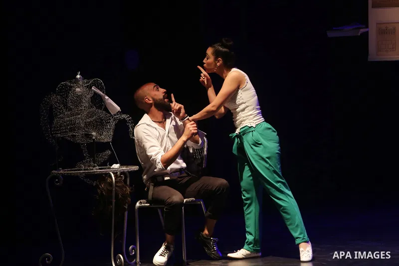 Palestinian actors perform in a play on a stage in the West Bank city of Ramallah, on June 25, 2018. Photo by Shadi Hatem