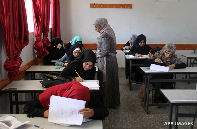Palestinians sit for the Literacy exam at a school organized by the Ministry of Education in Gaza City on June 25, 2018. Photo by Mahmoud Ajour