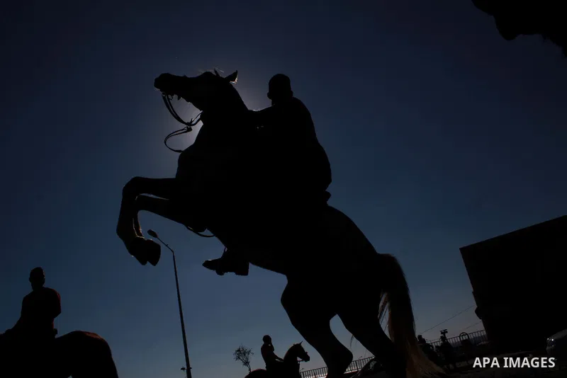 Palestinians ride their horses during a parade marking the Palestinian Olympic Day, in Gaza city, on June 25, 2018. Photo by Bashar Zakri