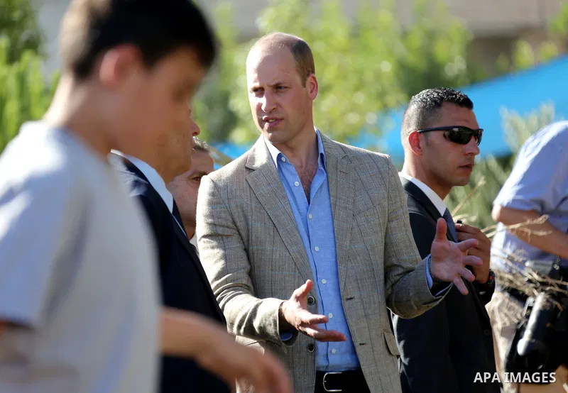 Britain's Prince William visits young Palestinian football players in the West Bank city of Ramallah on June 27, 2018. The Duke of Cambridge is the first member of the royal family to make an official visit to the Jewish...