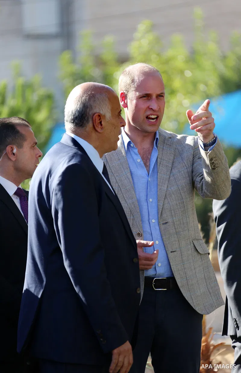 Head of the Palestinian Football Federation, Jibril Rajoub, talks to Britain's Prince William in the West Bank city of Ramallah on June 27, 2018. The Duke of Cambridge is the first member of the royal family to make an o...