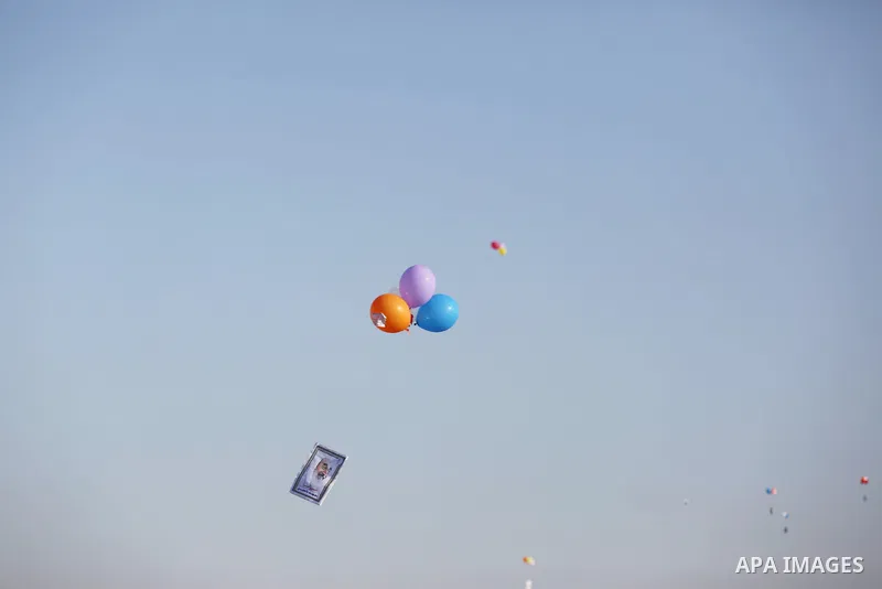 Balloons being flown by Palestinian children during a protest near tents at Gaza-Israel border, in Jabalia in the northern of Gaza Strip on June 27, 2018. Photo by Ashraf Amra