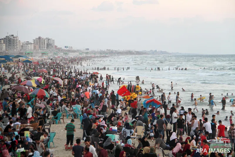 Palestinians enjoy their time at the sea coast of Gaza City June 29, 2018. Photo by Mahmoud Ajour