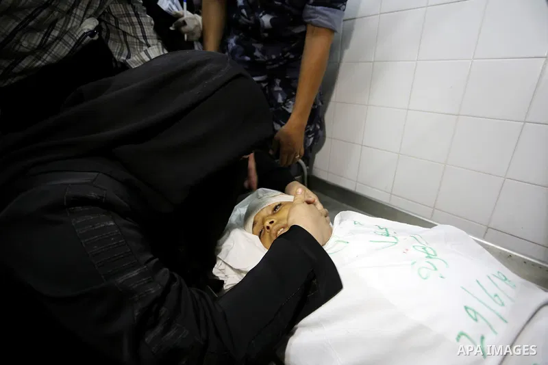 Relatives of 14-year-old Palestinian boy Yasser Abu Al-Naja, who was killed by Israeli troops during clashes in tents protest where Palestinian demand the right to return to their homeland at the Israel-Gaza border, mour...