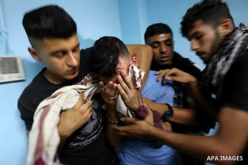 Relatives of Palestinian Mohammad Al-Hamayda, who was killed by Israeli troops during clashes in tents protest where Palestinian demand the right to return to their homeland at the Israel-Gaza border, mourn at a hospital...
