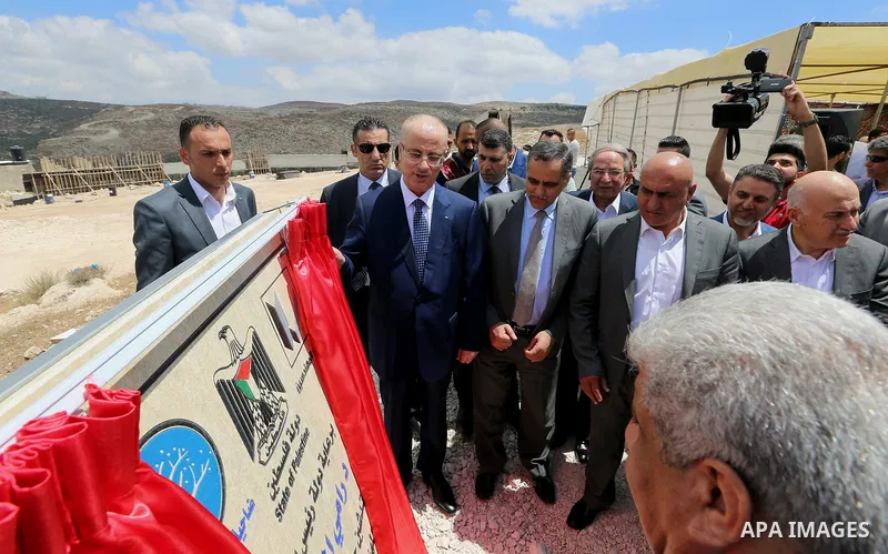 Palestinian Prime Minister Rami Hamdallah attends a ceremony of laying the foundation stone of the al-Zaytoun suburb, in the West Bank city of Nablus on June 30, 2018. Photo by Prime Minister Office