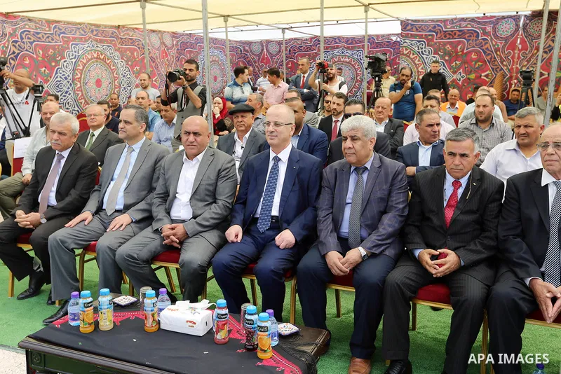 Palestinian Prime Minister Rami Hamdallah attends a ceremony of laying the foundation stone of the al-Zaytoun suburb, in the West Bank city of Nablus on June 30, 2018. Photo by Prime Minister Office