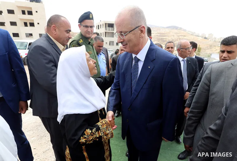 Palestinian Prime Minister Rami Hamdallah attends a ceremony of laying the foundation stone of the al-Zaytoun suburb, in the West Bank city of Nablus on June 30, 2018. Photo by Prime Minister Office