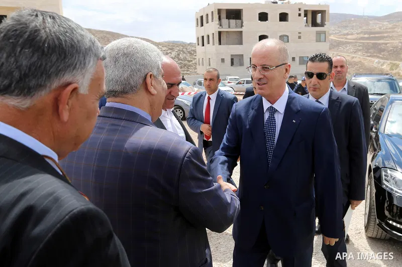Palestinian Prime Minister Rami Hamdallah attends a ceremony of laying the foundation stone of the al-Zaytoun suburb, in the West Bank city of Nablus on June 30, 2018. Photo by Prime Minister Office