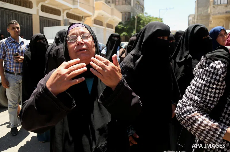 Relatives of 14-year-old Palestinian boy Yasser Abu Al-Naja, who was killed by Israeli troops during clashes in tents protest where Palestinian demand the right to return to their homeland at the Israel-Gaza border, mour...