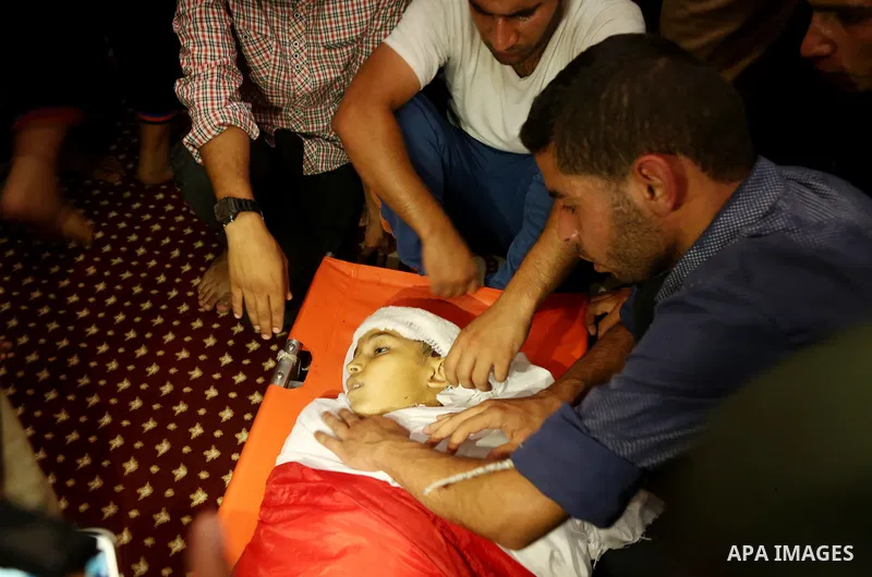 Relatives of 14-year-old Palestinian boy Yasser Abu Al-Naja, who was killed by Israeli troops during clashes in tents protest where Palestinian demand the right to return to their homeland at the Israel-Gaza border, mour...