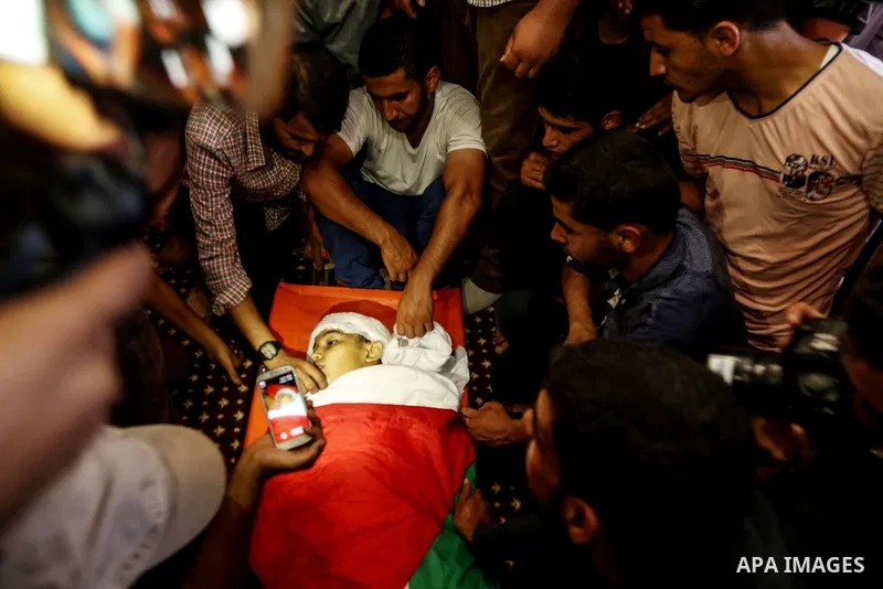 Relatives of 14-year-old Palestinian boy Yasser Abu Al-Naja, who was killed by Israeli troops during clashes in tents protest where Palestinian demand the right to return to their homeland at the Israel-Gaza border, mour...