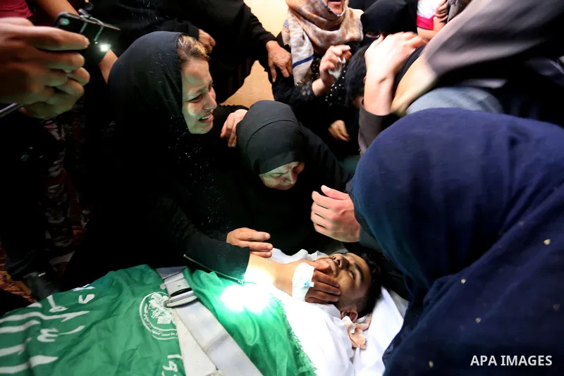 Relatives of 24-year-old Palestinian Mohammed al-Hamayda, who was killed by Israeli troops during clashes in tents protest where Palestinian demand the right to return to their homeland at the Israel-Gaza border, mourn o...