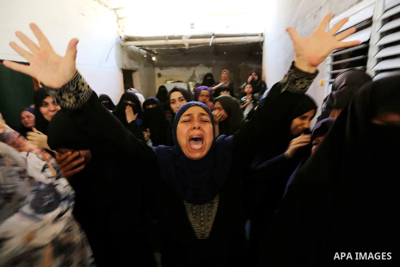 Relatives of 24-year-old Palestinian Mohammed al-Hamayda, who was killed by Israeli troops during clashes in tents protest where Palestinian demand the right to return to their homeland at the Israel-Gaza border, mourn d...
