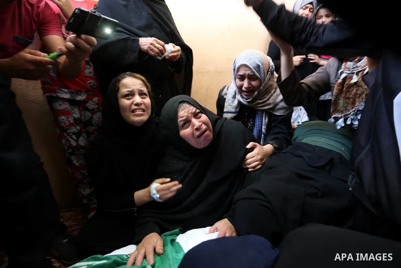 Relatives of 24-year-old Palestinian Mohammed al-Hamayda, who was killed by Israeli troops during clashes in tents protest where Palestinian demand the right to return to their homeland at the Israel-Gaza border, mourn o...