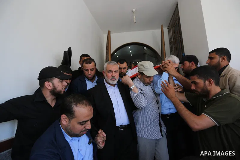 Mourners carry the body of 14-year-old Palestinian boy Yasser Abu Al-Naja, who was killed by Israeli troops during clashes in tents protest where Palestinian demand the right to return to their homeland at the Israel-Gaz...