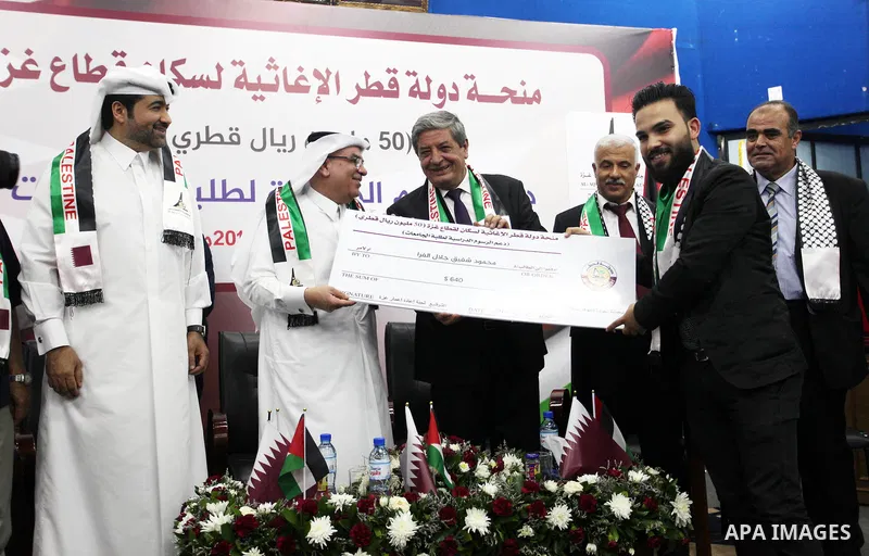 Qatar's Ambassador to the Palestinian Authority, Mohammed Al Emadi attends the ceremony of provide a grant to support the fees of Palestinian needy students at Al-Aqsa University, in Gaza city on June 30, 2018. Photo by...