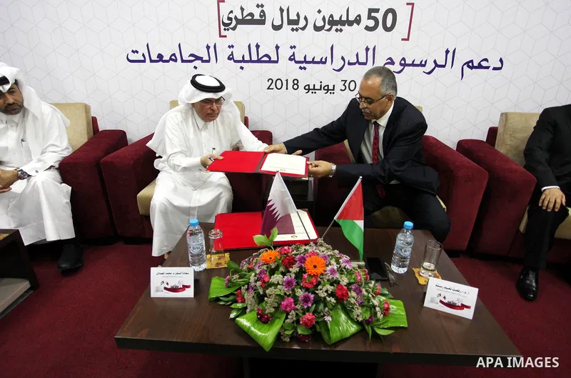 Qatar's Ambassador to the Palestinian Authority, Mohammed Al Emadi attends the ceremony of provide a grant to support the fees of Palestinian needy students at University College of Applied Sciences, in Gaza city on June...