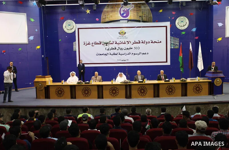 Qatar's Ambassador to the Palestinian Authority, Mohammed Al Emadi attends the ceremony of provide a grant to support the fees of Palestinian needy students at Islamic University, in Gaza city on June 30, 2018. Photo by...
