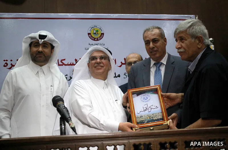 Qatar's Ambassador to the Palestinian Authority, Mohammed Al Emadi attends the ceremony of provide a grant to support the fees of Palestinian needy students at Al-Azhar University, in Gaza city on June 30, 2018. Photo by...