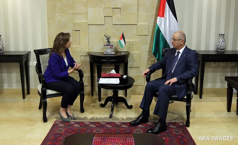 Palestinian Prime Minister Rami Hamdallah, receives the annual report of statistics and the national strategy for the development of official statistics, in the West Bank city of Ramallah on July 1, 2018. Photo by Prime...