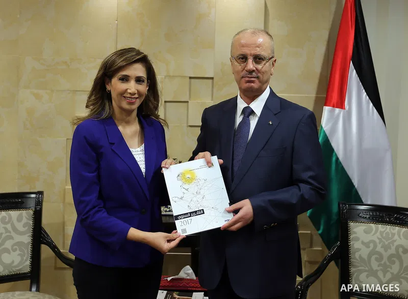 Palestinian Prime Minister Rami Hamdallah, receives the annual report of statistics and the national strategy for the development of official statistics, in the West Bank city of Ramallah on July 1, 2018. Photo by Prime...
