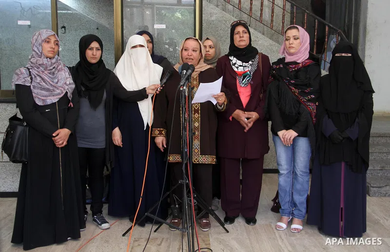 Coordinator of the Women's Committee in tthe National commission for the great return march and break Gaza siege, Ektemal Hamad speaks during a press conference, in Gaza city, on July 2, 2018. Photo by Mahmoud Ajour