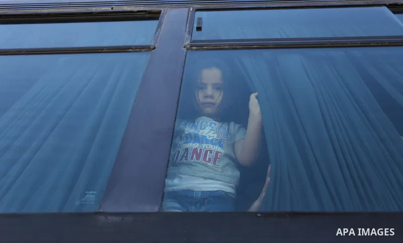 Palestinians wait for travel permits to cross into Egypt through the Rafah border crossing in Khan Yunis in the southern Gaza Strip on July 2, 2018. Photo by Ashraf Amra