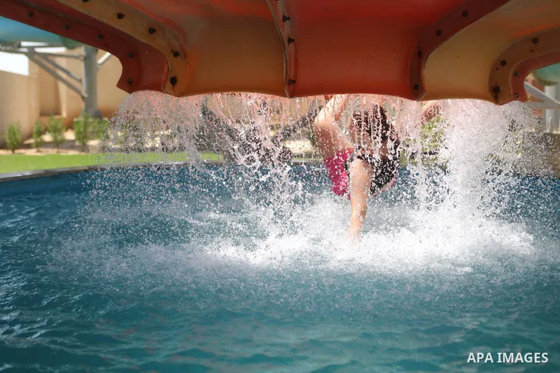 Palestinians swim in the water city "Safari Aqua Park" during the summer holiday, in the West Bank city of Jericho, on July 2, 2018. Photo by Shadi Hatem