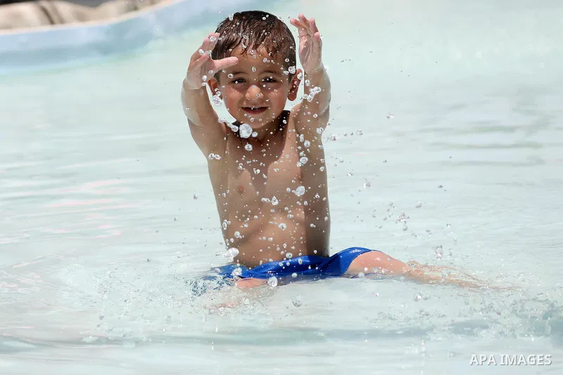 Palestinians swim in the water city "Safari Aqua Park" during the summer holiday, in the West Bank city of Jericho, on July 2, 2018. Photo by Shadi Hatem