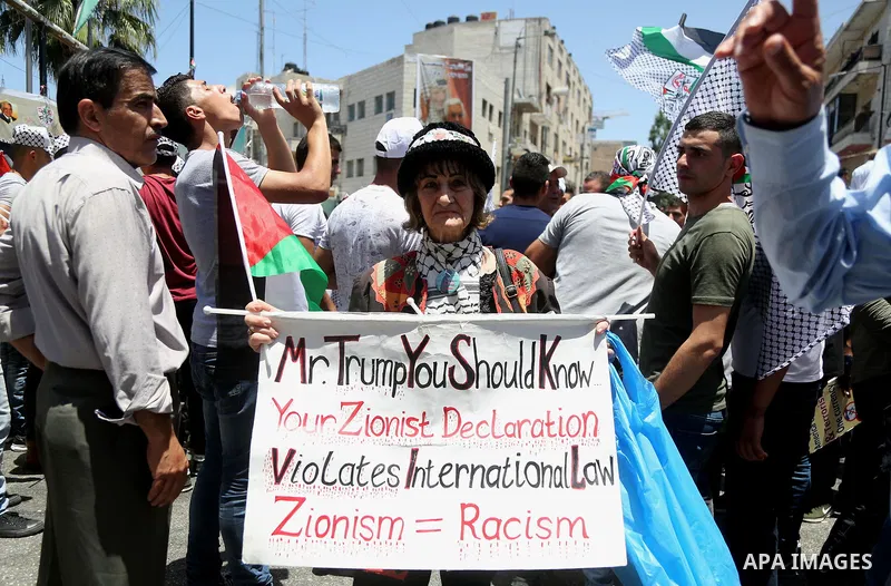 Palestinians take part during a demonstration against US policy supporting Israel and against "Deal of the Century" in the West Bank city of Ramallah on July 2, 2018. Photo by Shadi Hatem