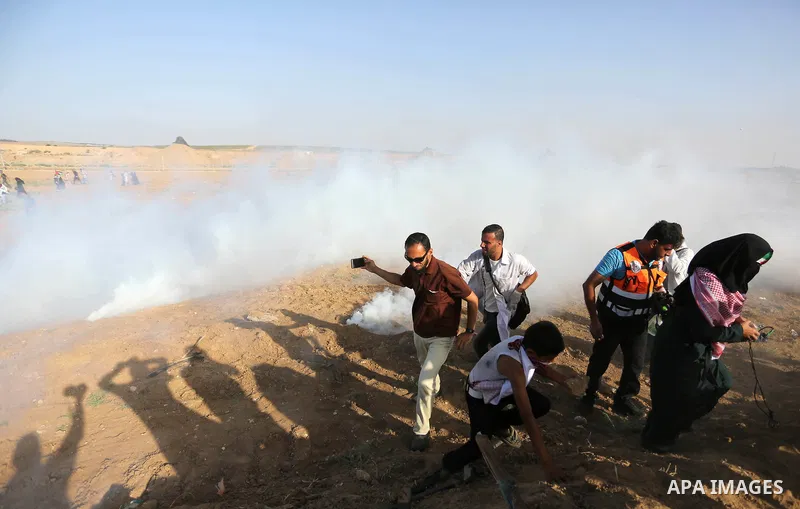 Protesters gather during a protest by Palestinian women where Palestinians demand the right to return to their homeland along the border with Israel east of Gaza City on July 3, 2018. Photo by Ashraf Amra
