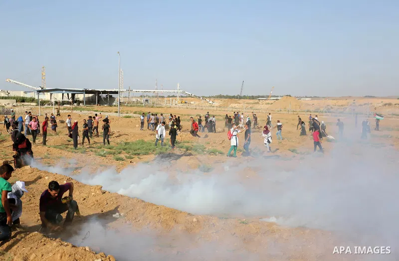 Protesters gather during a protest by Palestinian women where Palestinians demand the right to return to their homeland along the border with Israel east of Gaza City on July 3, 2018. Photo by Ashraf Amra
