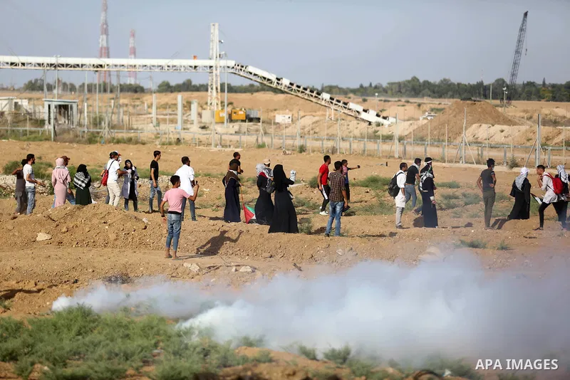 Palestinian women gather during a protest where Palestinians demand the right to return to their homeland along the border with Israel east of Gaza City on July 3, 2018. Photo by Ashraf Amra