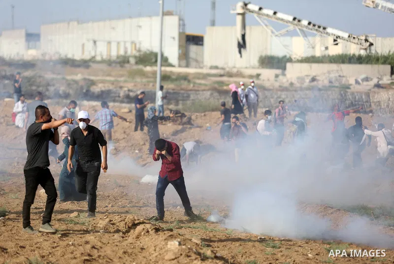 Palestinian women gather during a protest where Palestinians demand the right to return to their homeland along the border with Israel east of Gaza City on July 3, 2018. Photo by Ashraf Amra