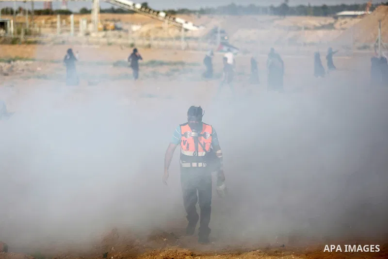 Palestinian women gather during a protest where Palestinians demand the right to return to their homeland along the border with Israel east of Gaza City on July 3, 2018. Photo by Ashraf Amra