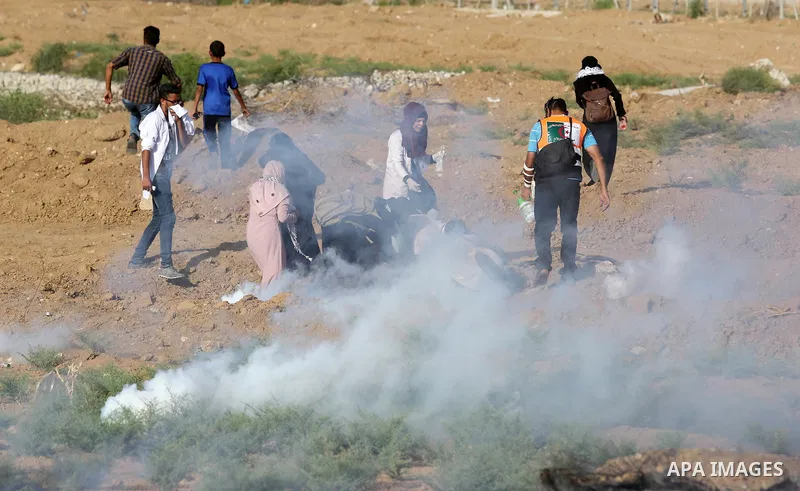 Protesters gather during a protest by Palestinian women where Palestinians demand the right to return to their homeland along the border with Israel east of Gaza City on July 3, 2018. Photo by Ashraf Amra