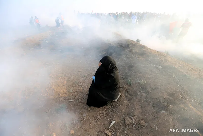 Palestinian women gather during a protest where Palestinians demand the right to return to their homeland along the border with Israel east of Gaza City on July 3, 2018. Photo by Atia Darwish