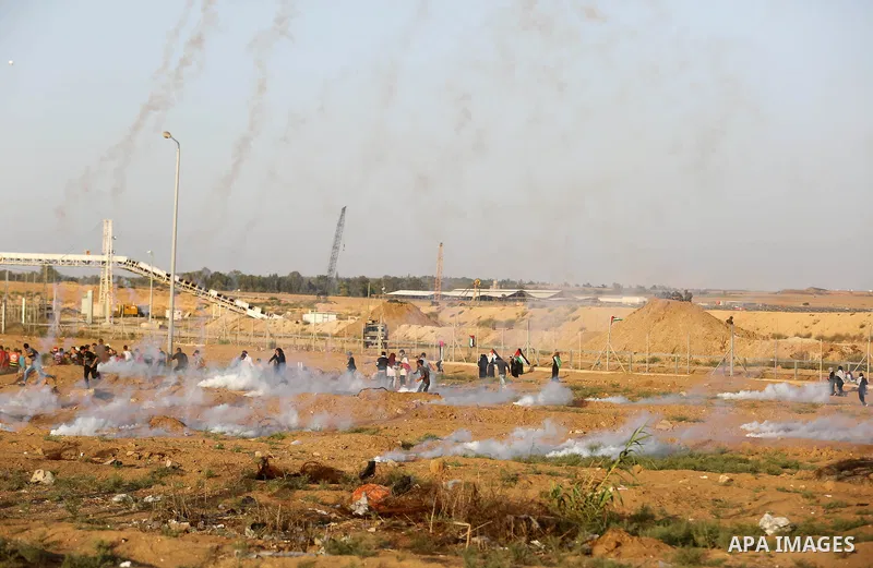 Protesters gather during a protest by Palestinian women where Palestinians demand the right to return to their homeland along the border with Israel east of Gaza City on July 3, 2018. Photo by Ashraf Amra