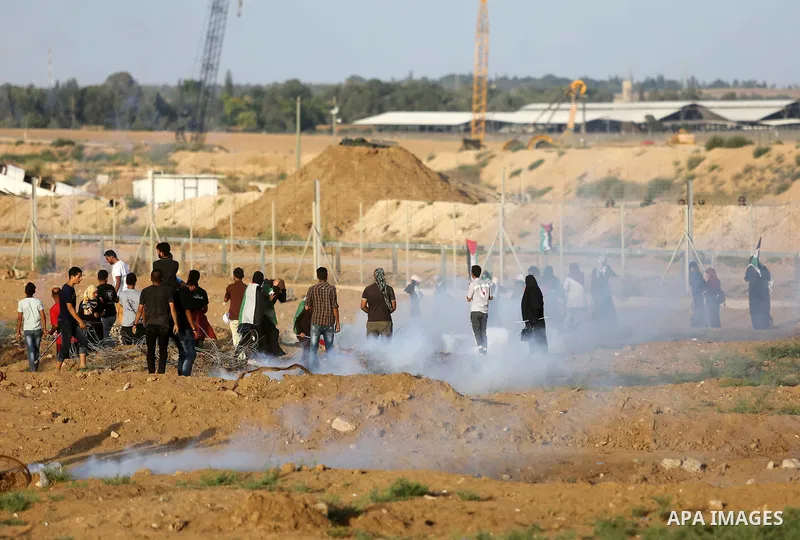 Protesters gather during a protest by Palestinian women where Palestinians demand the right to return to their homeland along the border with Israel east of Gaza City on July 3, 2018. Photo by Ashraf Amra