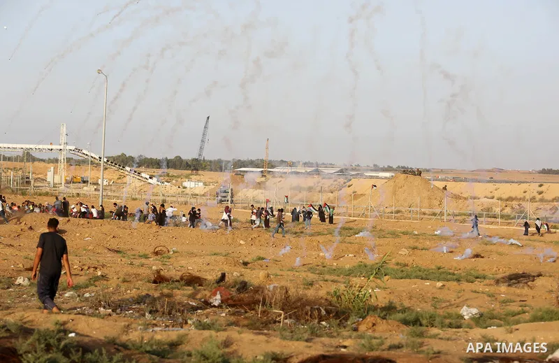 Protesters gather during a protest by Palestinian women where Palestinians demand the right to return to their homeland along the border with Israel east of Gaza City on July 3, 2018. Photo by Ashraf Amra